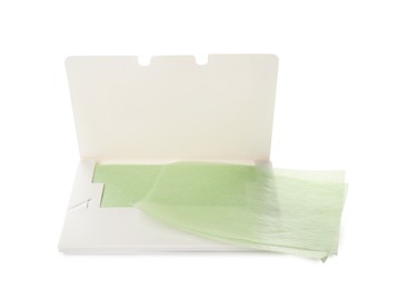 Package with facial oil blotting tissues on white background. Mattifying wipes