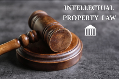 Image of Text Intellectual Property Law near judge's gavel on grey background