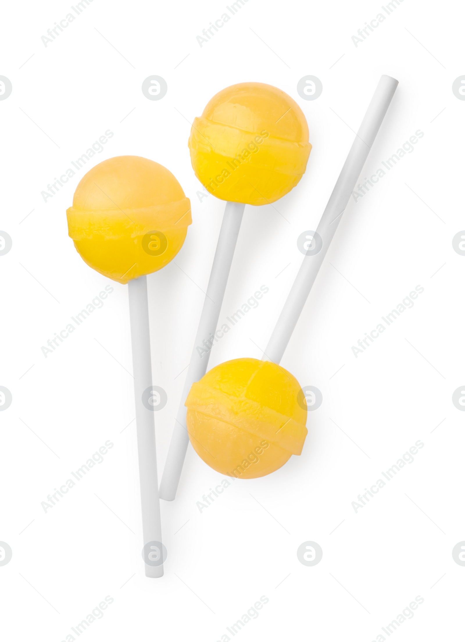 Photo of Many sweet yellow lollipops isolated on white, top view