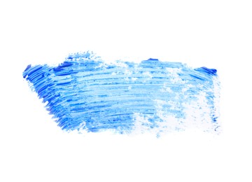 Photo of Smear of blue mascara for eyelashes on white background