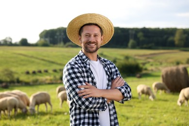 Photo of Portrait of smiling man on pasture at farm