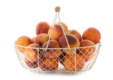 Metal basket with fresh sweet peaches on white background