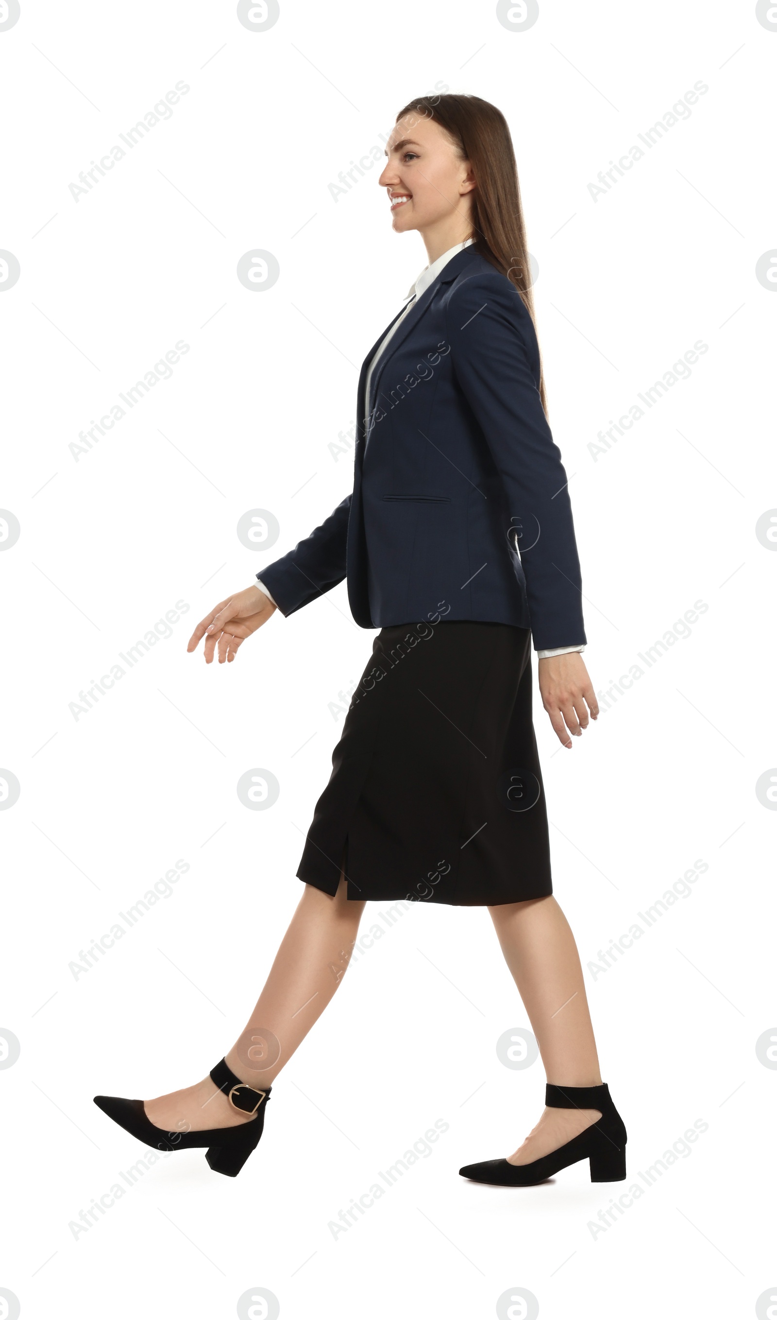 Photo of Young businesswoman in formal suit walking on white background