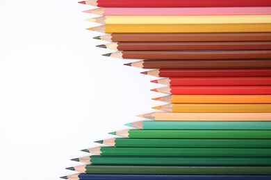 Photo of Composition with color pencils on white background, top view