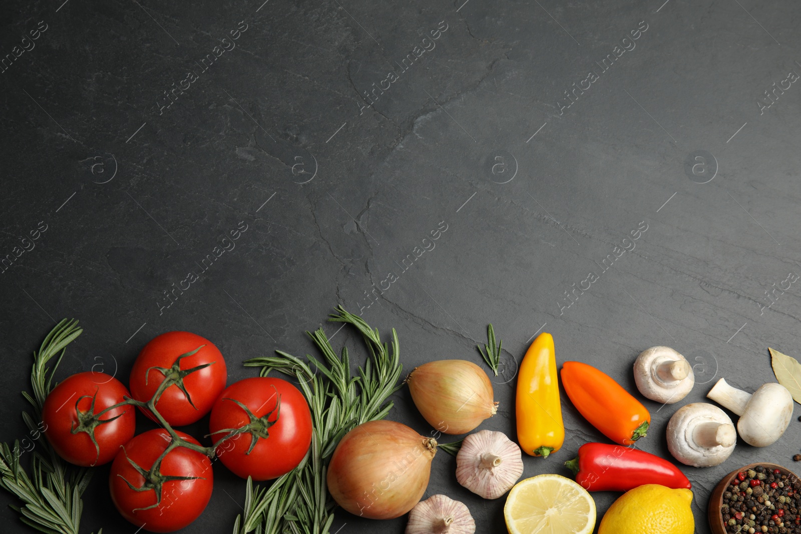 Photo of Flat lay composition with ingredients for cooking on black table. Space for text