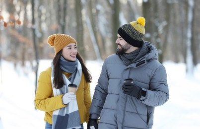 Beautiful young couple enjoying winter day outdoors