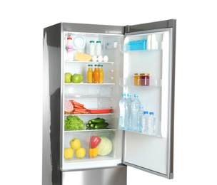 Photo of Open refrigerator with many different products on white background