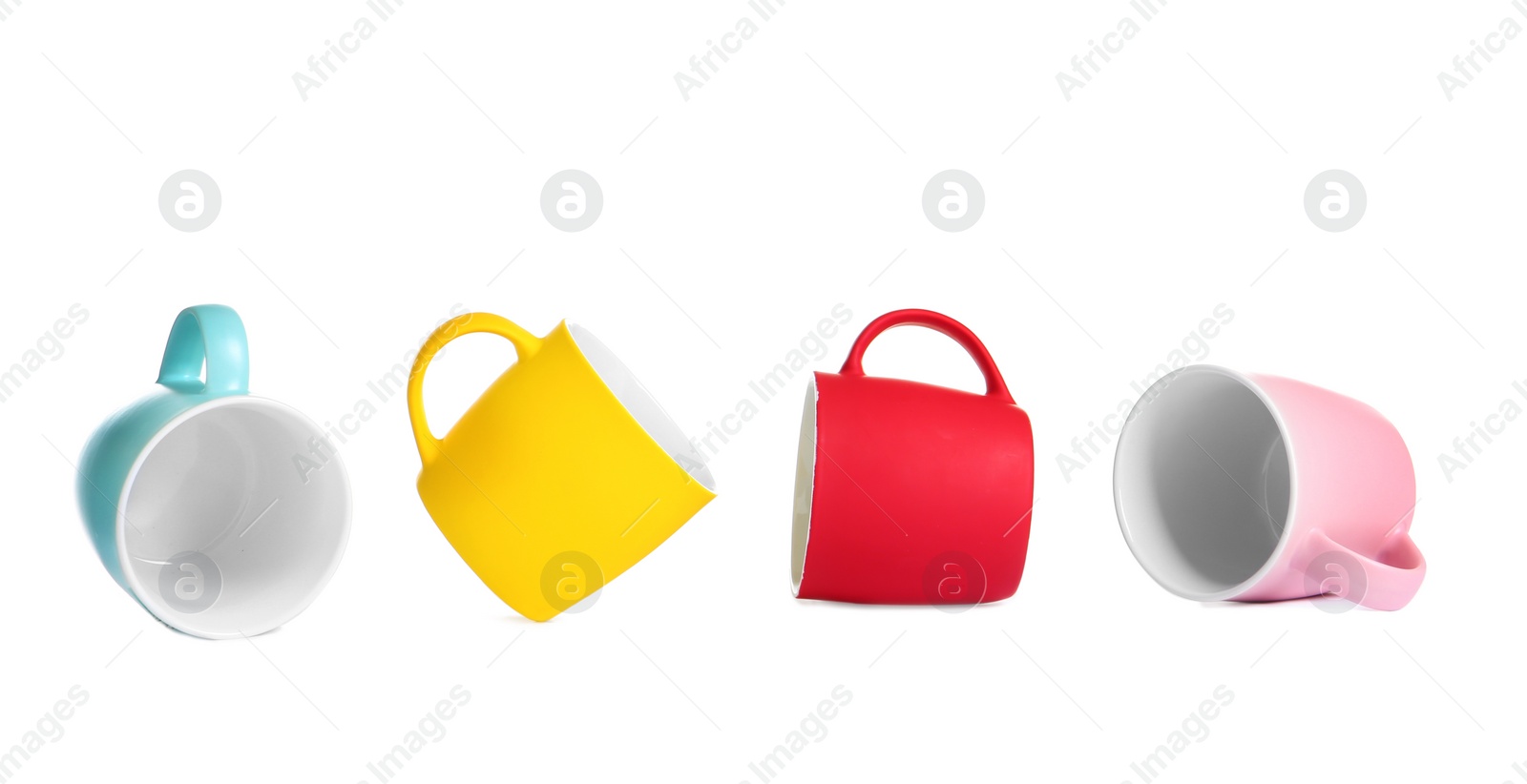 Photo of Different colorful cups on white background