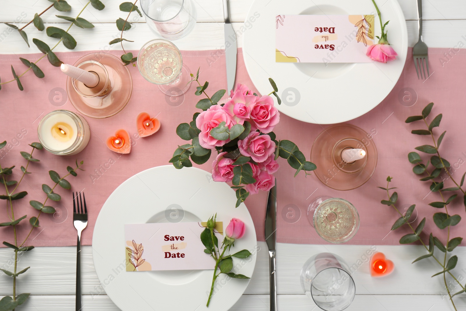 Photo of Romantic table setting with flowers and candles, flat lay