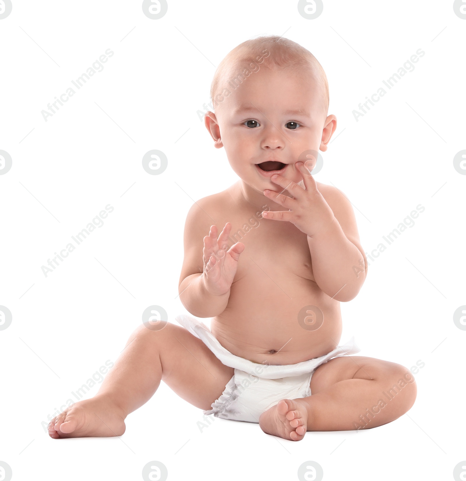 Photo of Cute little baby sitting on white background