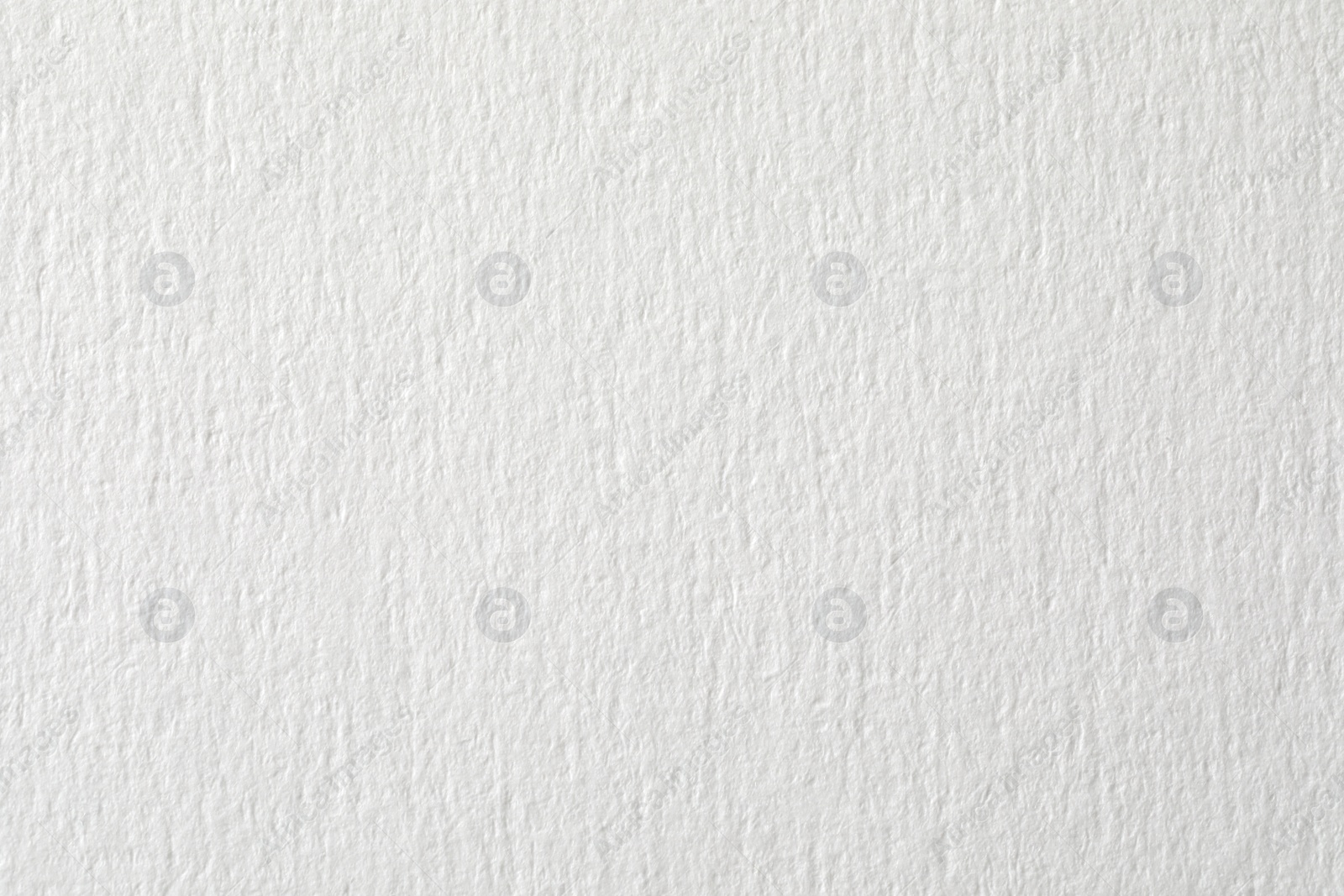 Photo of Texture of white paper sheet as background, closeup