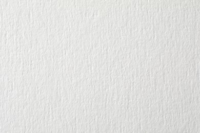 Photo of Texture of white paper sheet as background, closeup