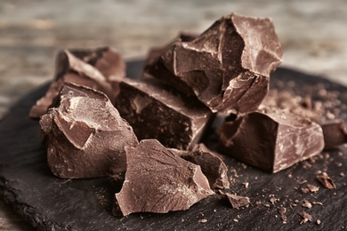 Delicious dark chocolate on slate plate, closeup