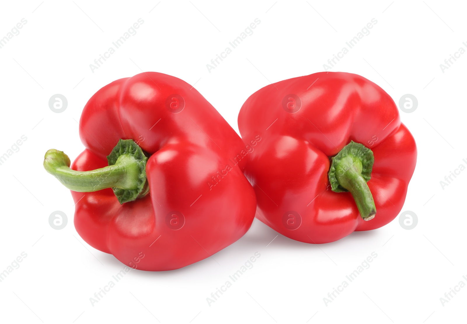 Photo of Ripe red bell peppers isolated on white