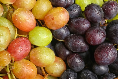 Photo of Fresh ripe juicy grapes as background, closeup