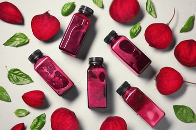 Photo of Flat lay composition with beet smoothies on light background