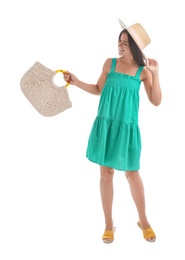 Photo of Young woman with stylish straw bag on white background