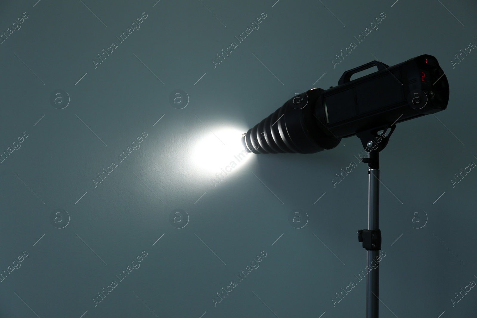 Photo of Studio lighting against gray background. Professional photo equipment