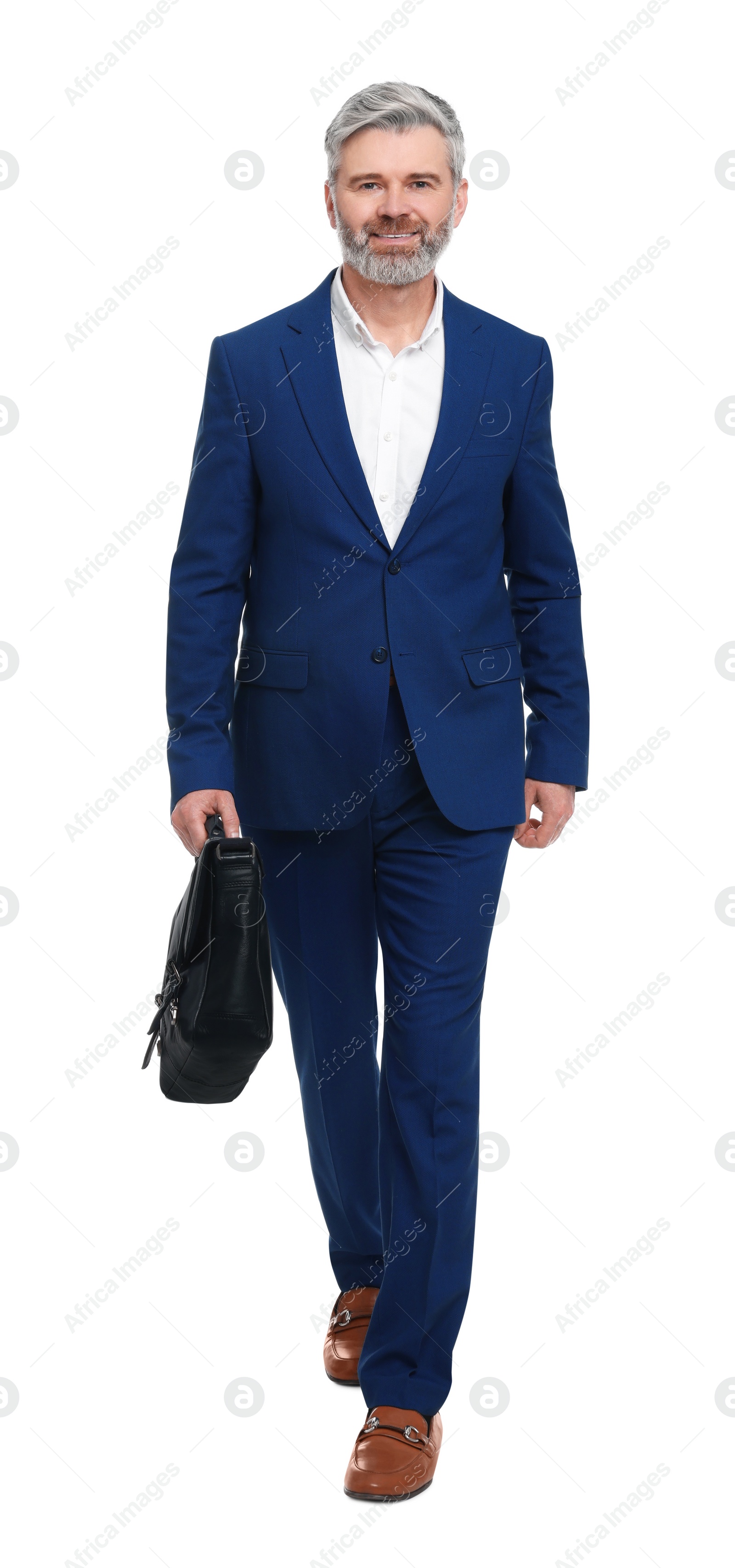 Photo of Mature businessman with briefcase walking on white background