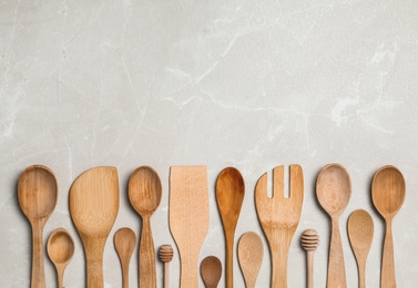 Photo of Set of cooking utensils on grey table, flat lay, Space for text