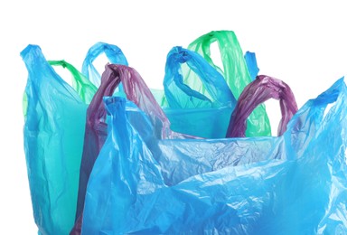 Photo of Many different plastic bags on white background