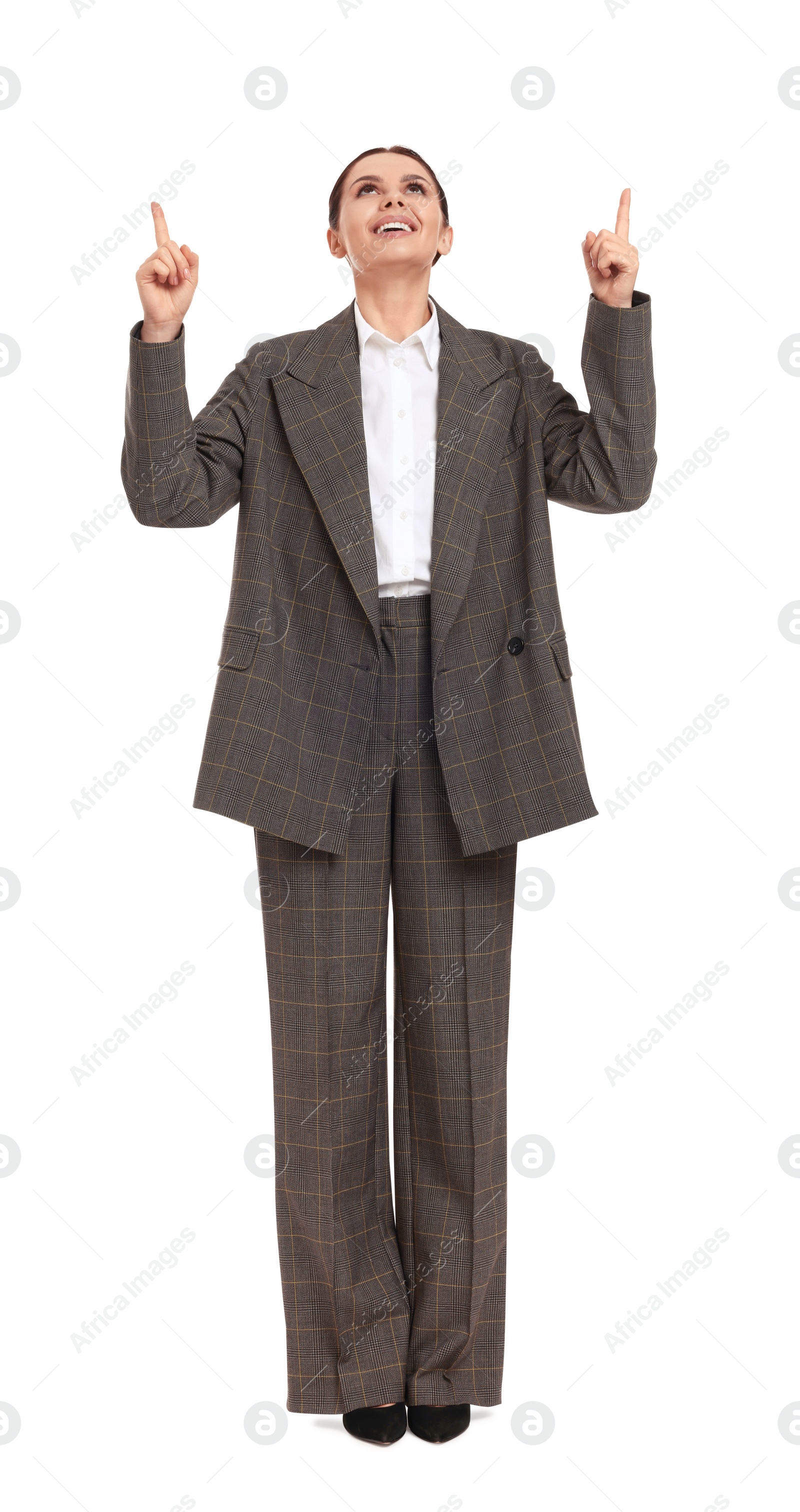 Photo of Beautiful businesswoman in suit pointing at something on white background