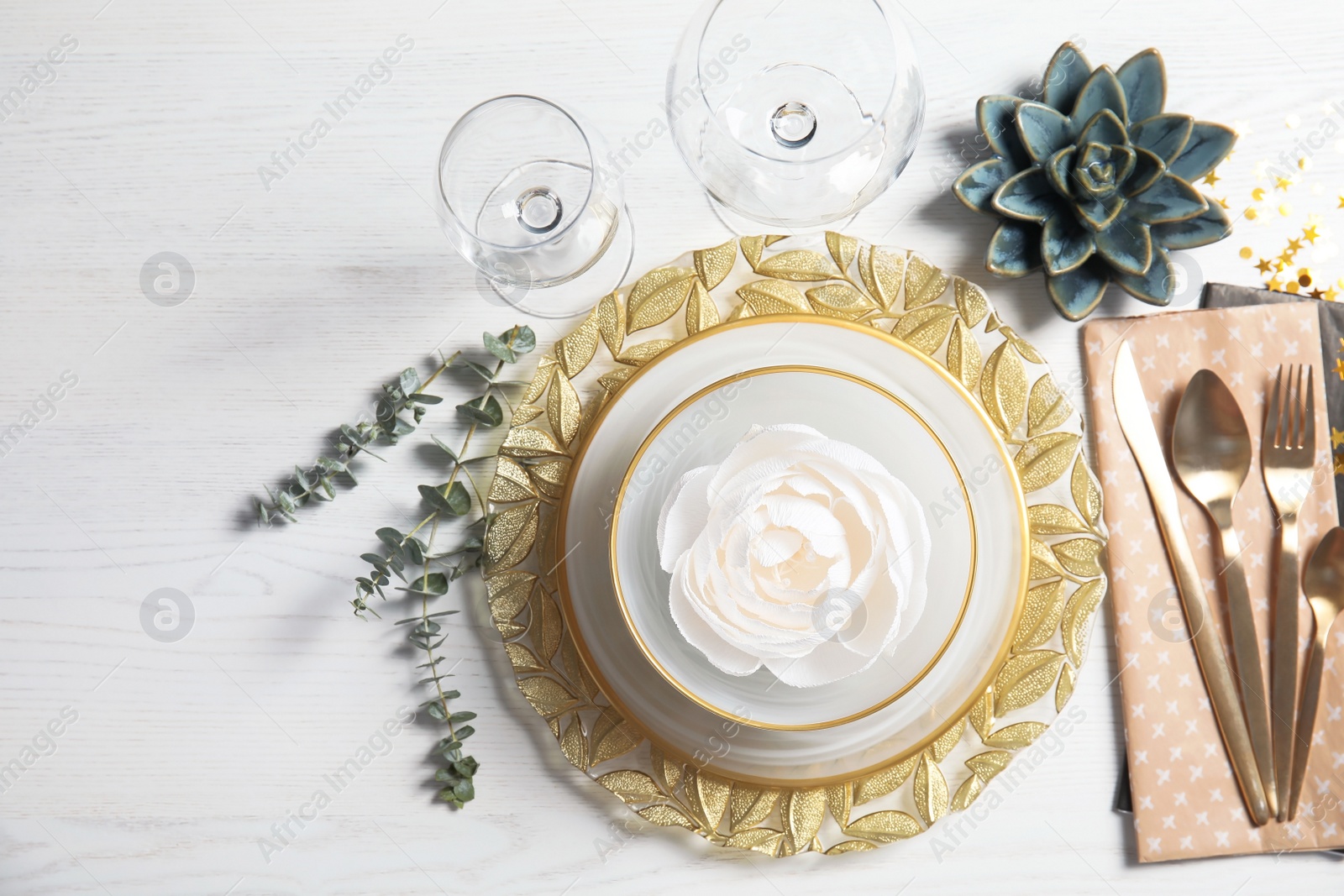 Photo of Elegant table setting on light background, top view