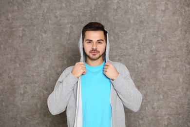 Photo of Portrait of handsome man on grey background