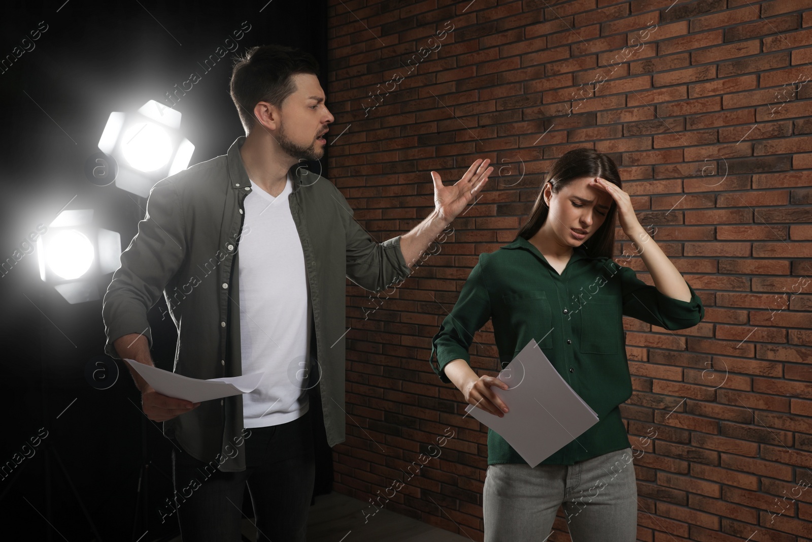 Photo of Professional actors rehearsing on stage in theatre