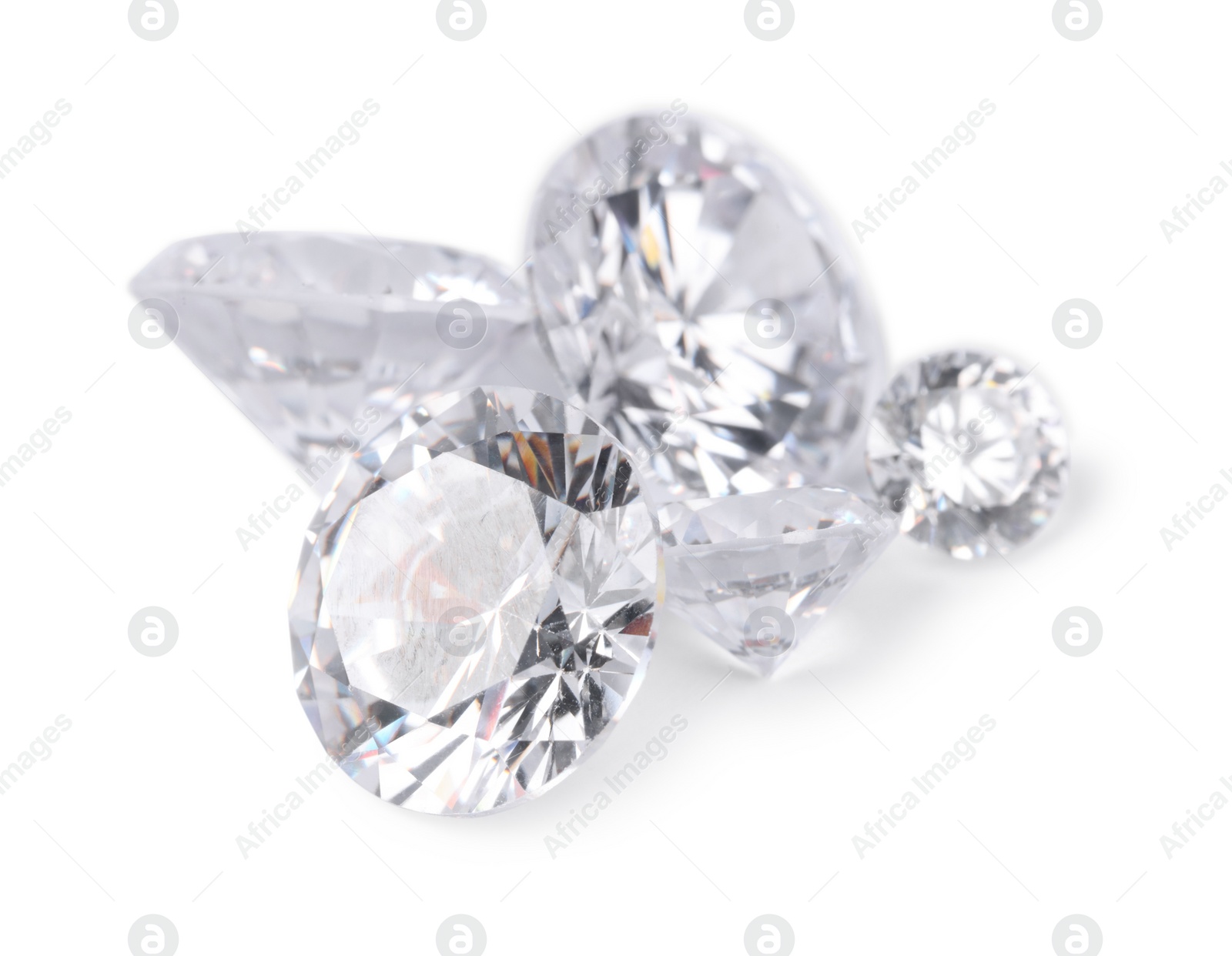 Photo of Many beautiful shiny diamonds isolated on white