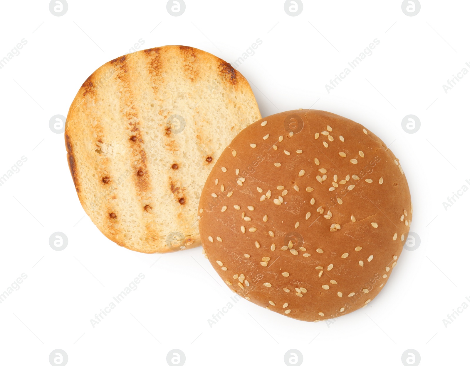 Photo of Halves of grilled burger bun isolated on white, top view