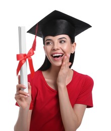 Photo of Emotional student with graduation hat and diploma on white background