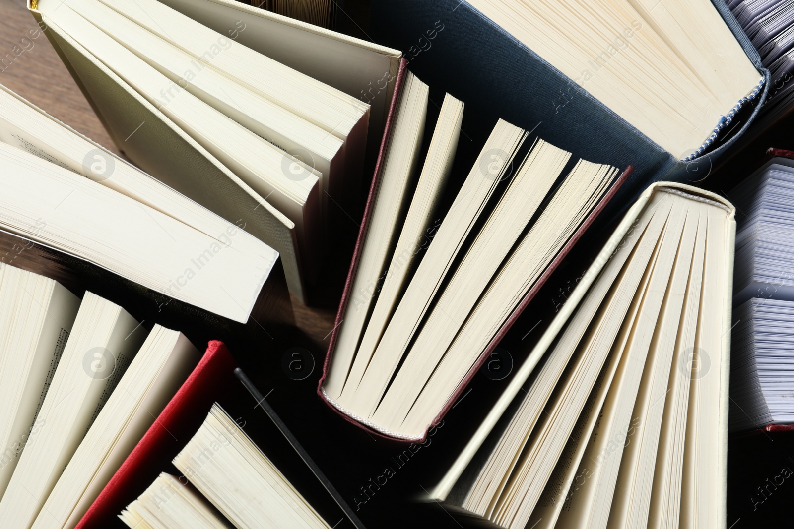 Photo of Many hardcover books as background, top view