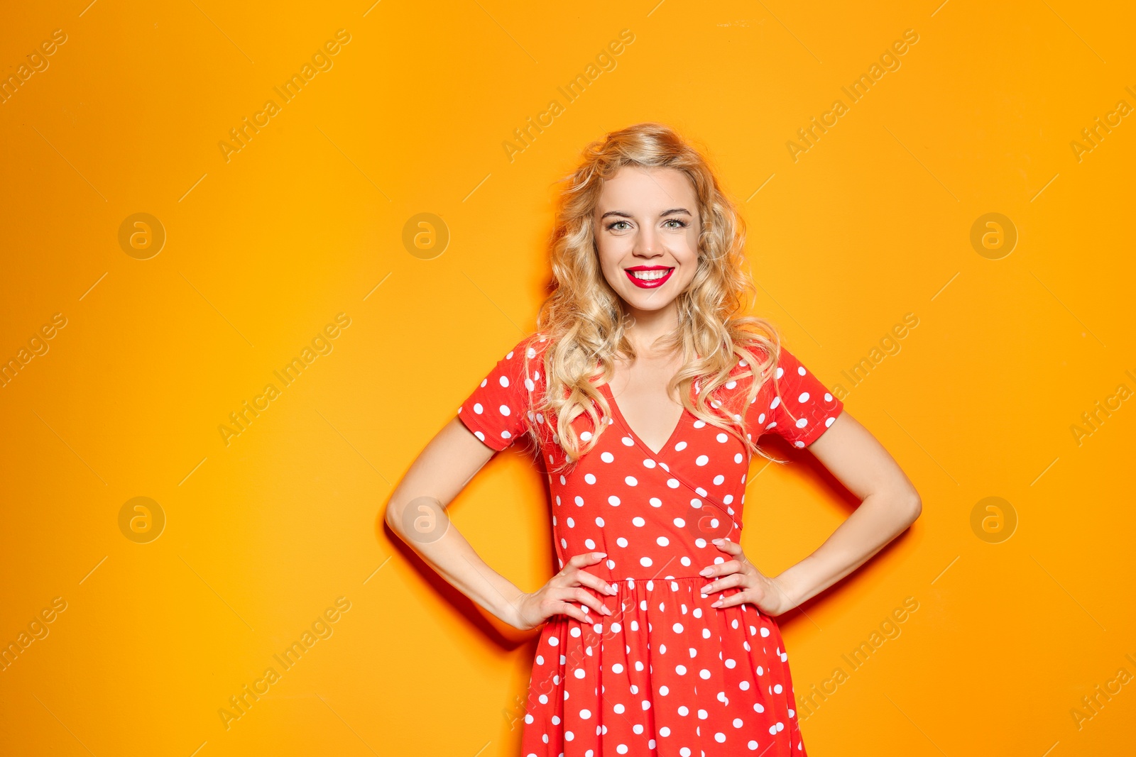 Photo of Stylish young woman posing on color background