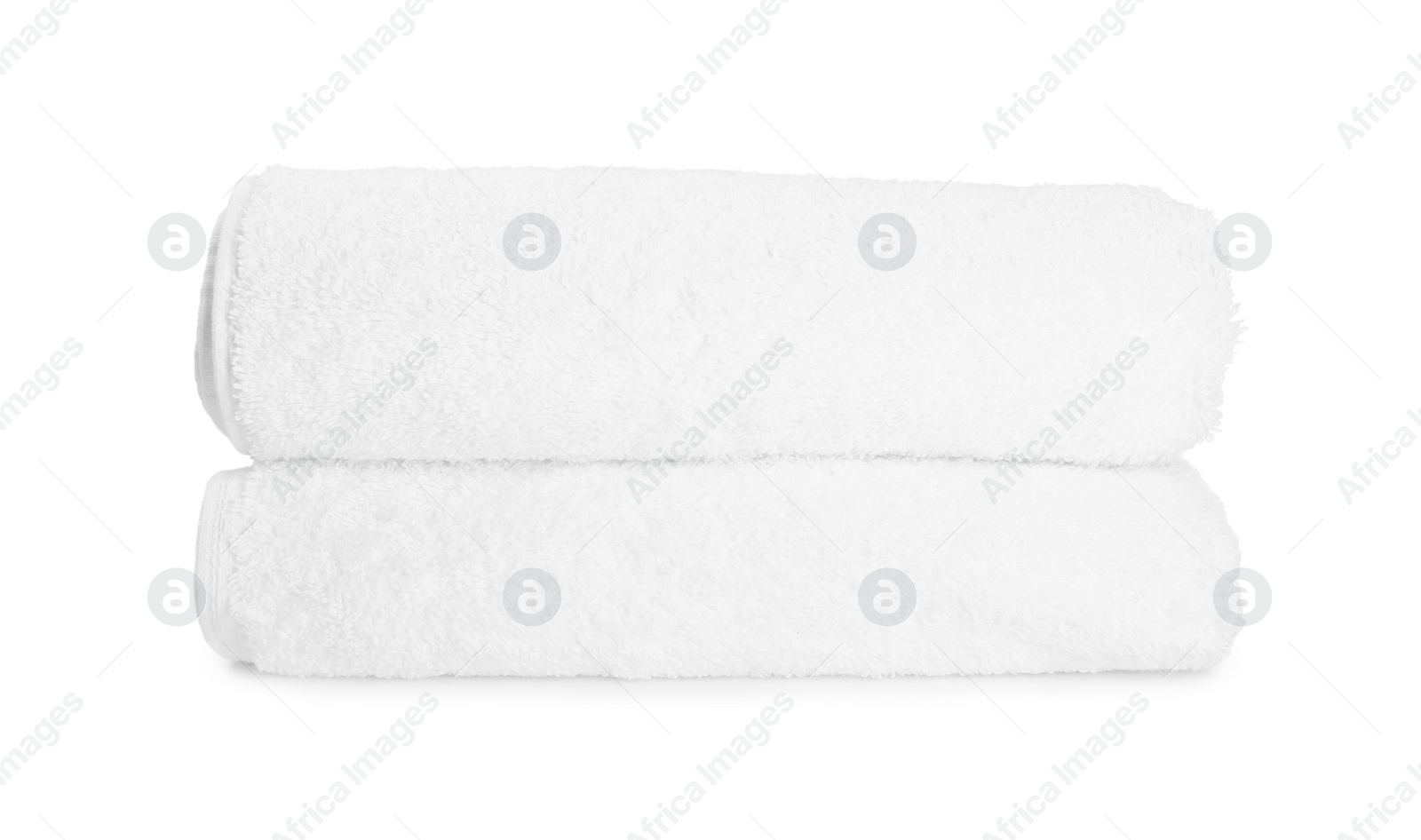Photo of Two folded terry towels isolated on white