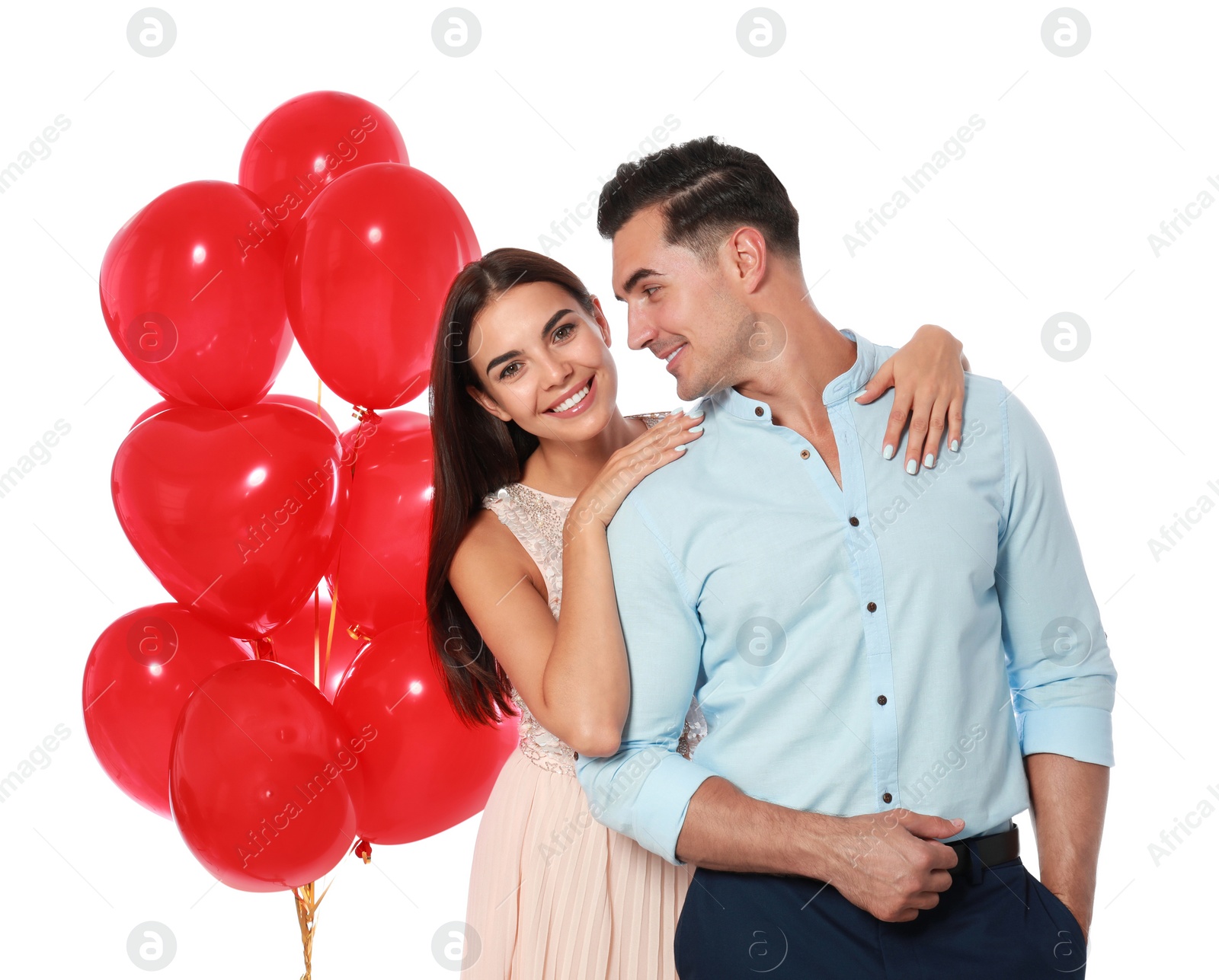 Photo of Beautiful couple with heart shaped balloons on white background