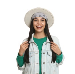 Photo of Fashionable young woman in stylish outfit with bandana on white background