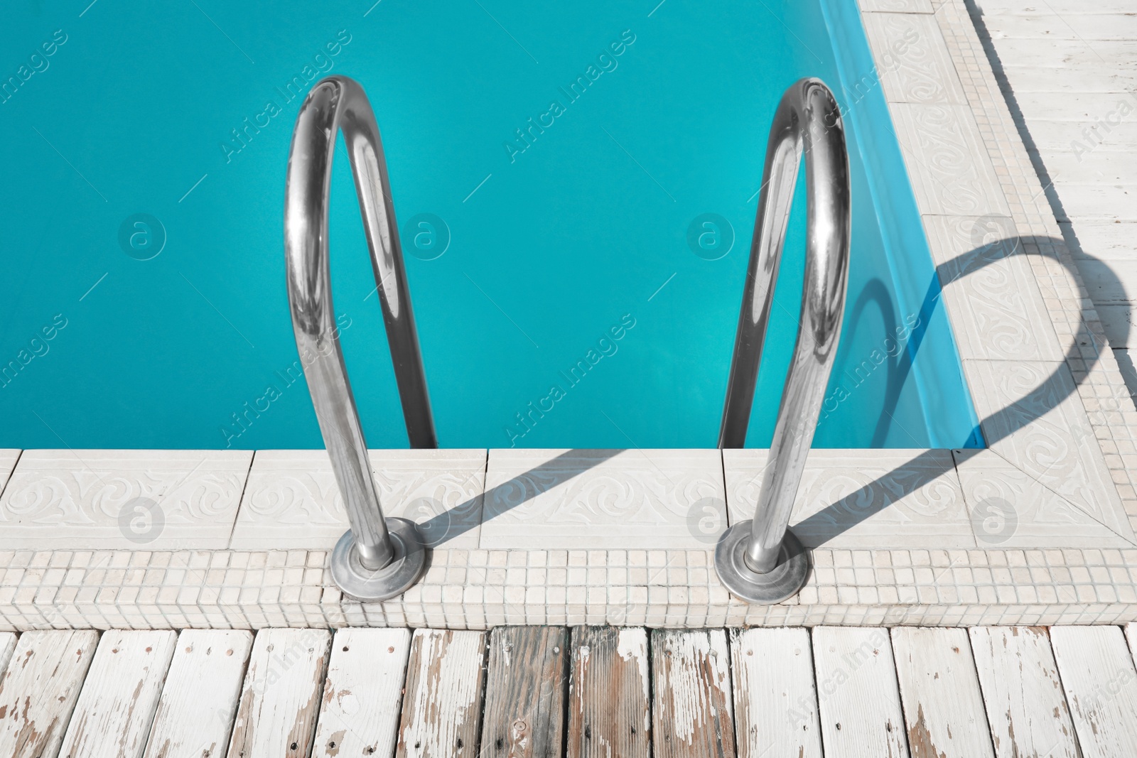 Photo of Modern swimming pool with ladder at resort