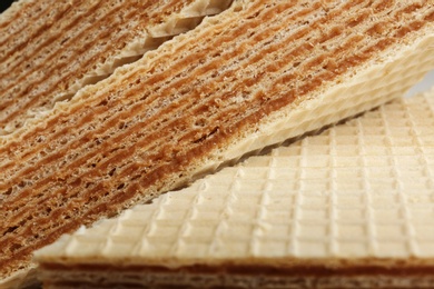 Photo of Delicious crispy wafers as background, closeup view