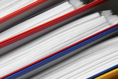 Photo of Colorful binder office folders as background, closeup