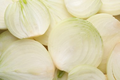 Photo of Pieces of fresh ripe onion as background