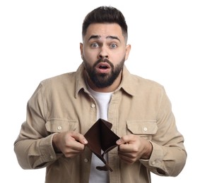 Confused man showing empty wallet on white background