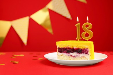 Photo of Coming of age party - 18th birthday. Delicious cake with number shaped candles on red background, space for text