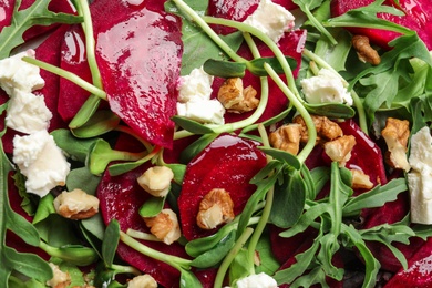 Delicious salad with beet as background, closeup