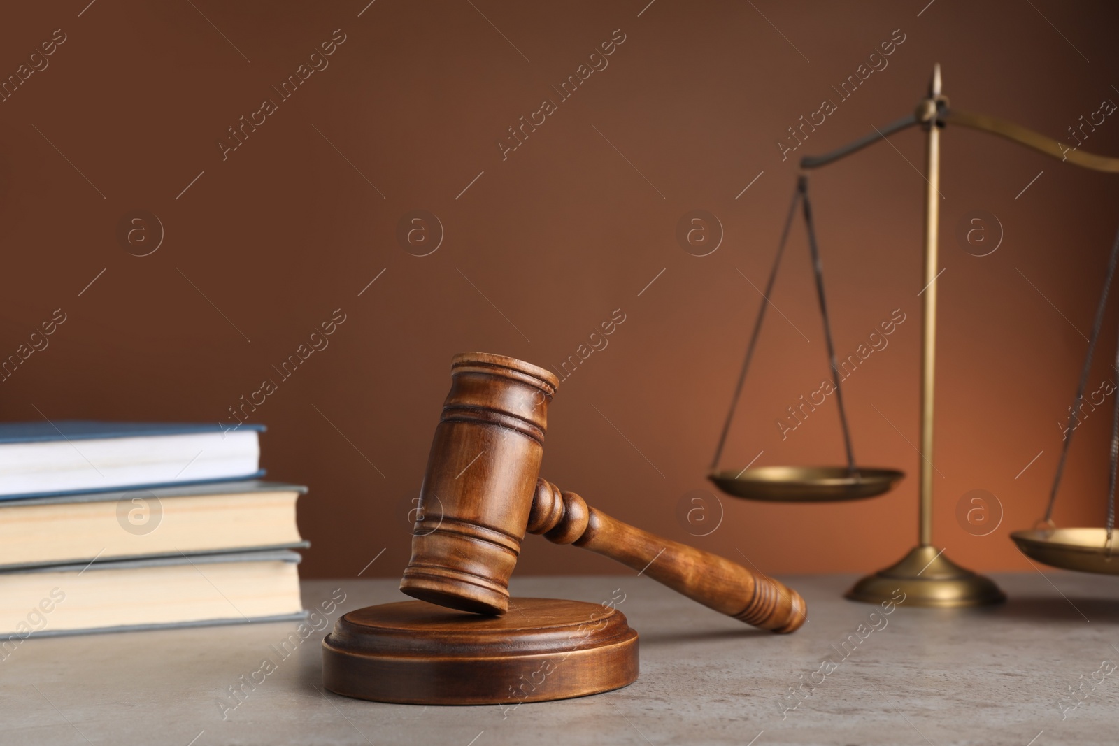 Photo of Wooden gavel on grey table. Law concept