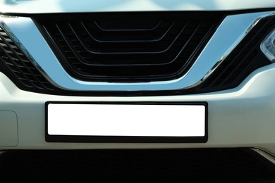Photo of Closeup view of modern car with license plate