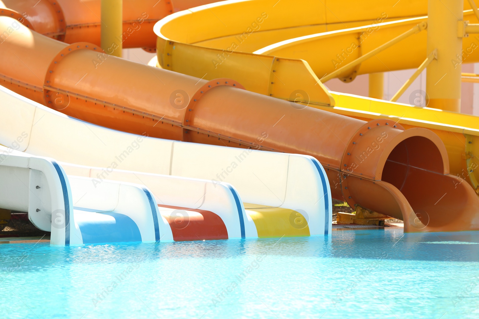 Photo of Different colorful slides in water park on sunny day