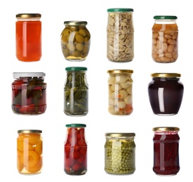 Set of jars with jams and pickled foods on white background