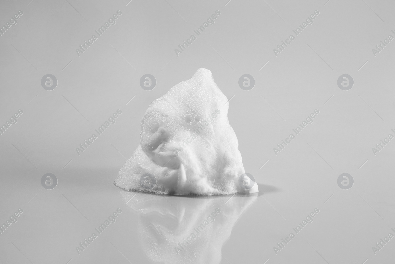 Photo of Sample of cleansing foam on light background. Cosmetic product