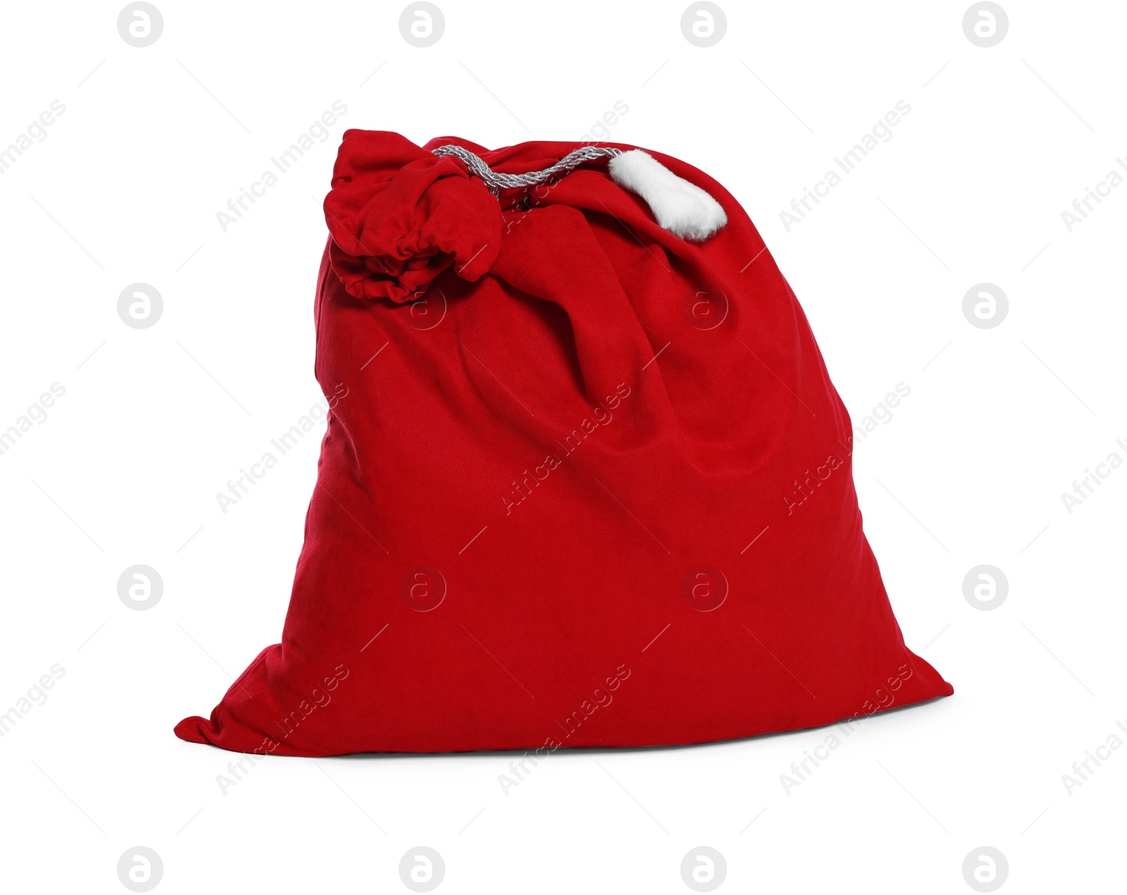 Photo of Santa Claus red bag full of presents isolated on white